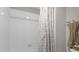 Simple bathroom with shower/tub combo and neutral decor at 1150 Blarney St, Minneola, FL 34715