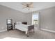 Cozy bedroom with a single bed, ceiling fan, and window with a view at 1150 Blarney St, Minneola, FL 34715