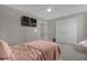 Serene bedroom with a twin bed, double door closet, and TV at 1150 Blarney St, Minneola, FL 34715