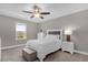 Bright bedroom with a queen-size bed and window at 1150 Blarney St, Minneola, FL 34715