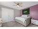 Bedroom with a day bed, ceiling fan, and accent wall at 1150 Blarney St, Minneola, FL 34715