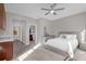 Bright bedroom with a comfortable bed and built-in shelving at 1150 Blarney St, Minneola, FL 34715