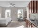 Main bedroom with built-in wet bar and large windows at 1150 Blarney St, Minneola, FL 34715