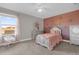 Charming bedroom with a twin bed, dresser, and personalized decor at 1150 Blarney St, Minneola, FL 34715