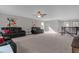 Bright bonus room with ceiling fan, two sofas, and natural light at 1150 Blarney St, Minneola, FL 34715