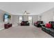 Bonus room features two reclining sofas and a large screen TV at 1150 Blarney St, Minneola, FL 34715