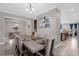 Spacious dining room with a large table and view of kitchen at 1150 Blarney St, Minneola, FL 34715