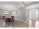 Elegant dining room with a large table and chandelier at 1150 Blarney St, Minneola, FL 34715