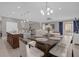 Modern kitchen with island, stainless steel appliances, and breakfast bar at 1150 Blarney St, Minneola, FL 34715