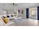 Bright living area showcasing a comfortable sectional sofa and backyard access at 1150 Blarney St, Minneola, FL 34715