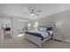 Main bedroom with king bed and view into bonus room at 1150 Blarney St, Minneola, FL 34715