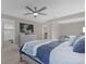 Main bedroom with king bed, dresser, and ensuite bathroom access at 1150 Blarney St, Minneola, FL 34715