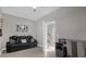 Home office with a black leather couch and a workspace near the stairs at 1150 Blarney St, Minneola, FL 34715
