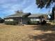Ranch home with carport, mature landscaping and spacious yard at 1344 Cr 437, Lake Panasoffkee, FL 33538