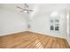 Spacious bedroom featuring wood flooring and a ceiling fan at 1589 Arial Pl, The Villages, FL 32162