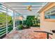 Relaxing patio with pergola, ceiling fan, and flagstone flooring at 1589 Arial Pl, The Villages, FL 32162