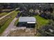 Aerial view of a home on a large lot with a long driveway at 1641 Cr 416N, Lake Panasoffkee, FL 33538