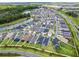 An aerial view of the community, showcasing numerous homes and landscaping at 1658 Galloway Dr, The Villages, FL 32163