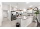 Spacious kitchen with stainless steel appliances and an island at 1658 Galloway Dr, The Villages, FL 32163