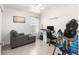 Home office with a comfortable chair, desk, and exercise equipment at 1658 Galloway Dr, The Villages, FL 32163