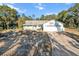 Single-story home with a large yard and driveway at 17469 Sw 35Th Avenue Rd, Ocala, FL 34473
