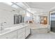 Large bathroom with a corner bathtub and double vanity at 17469 Sw 35Th Avenue Rd, Ocala, FL 34473