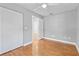 Bedroom with wood floors, white louvered doors and ceiling fan at 17469 Sw 35Th Avenue Rd, Ocala, FL 34473
