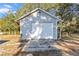 Single car detached garage with white door at 17469 Sw 35Th Avenue Rd, Ocala, FL 34473