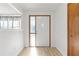 Bright entryway with a white door and wood flooring at 17469 Sw 35Th Avenue Rd, Ocala, FL 34473