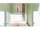White front door with a glass sidelight and doormat at 17469 Sw 35Th Avenue Rd, Ocala, FL 34473