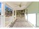 Covered porch with a ceiling fan and tile flooring at 17469 Sw 35Th Avenue Rd, Ocala, FL 34473