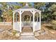 White gazebo with wooden flooring and picket fence at 17469 Sw 35Th Avenue Rd, Ocala, FL 34473