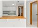 Kitchen with white cabinets and a breakfast bar at 17469 Sw 35Th Avenue Rd, Ocala, FL 34473