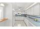 Bright kitchen features white cabinets, blue countertops, and tile backsplash at 17469 Sw 35Th Avenue Rd, Ocala, FL 34473