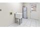 Laundry room with utility sink and water heater at 17469 Sw 35Th Avenue Rd, Ocala, FL 34473