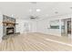 Spacious living room with a stone fireplace and hardwood floors at 17469 Sw 35Th Avenue Rd, Ocala, FL 34473