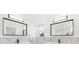 Modern bathroom with two sinks, marble countertops and large mirrors at 2051 Palo Alto Ave, The Villages, FL 32159