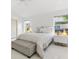 Spacious bedroom with a plush bed, ample natural light, and modern nightstands at 2051 Palo Alto Ave, The Villages, FL 32159
