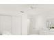 Light and airy bedroom with white built-ins and ceiling fan at 2051 Palo Alto Ave, The Villages, FL 32159