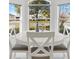 Bright breakfast nook with white table and chairs, overlooking the street at 2051 Palo Alto Ave, The Villages, FL 32159