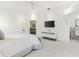 Bright main bedroom with a comfortable bed and ensuite access at 2051 Palo Alto Ave, The Villages, FL 32159