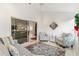 Sunroom with sliding glass doors, plush seating, and a view of the home's interior at 2051 Palo Alto Ave, The Villages, FL 32159