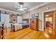 Bright bedroom featuring hardwood floors and built-in storage at 214 S Woodland St, Winter Garden, FL 34787