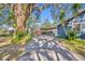 Covered carport providing parking for two cars, adjacent to the house at 214 S Woodland St, Winter Garden, FL 34787