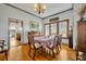 Elegant dining room with hardwood floors, a formal table setting, and views to kitchen at 214 S Woodland St, Winter Garden, FL 34787