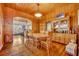 Dining room with wood table and chairs, built-in hutch and view to kitchen at 214 S Woodland St, Winter Garden, FL 34787