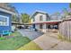 Two-story house with covered parking and a spacious driveway at 214 S Woodland St, Winter Garden, FL 34787