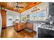 Charming kitchen with wood cabinets, stainless steel appliances, and wood ceiling at 214 S Woodland St, Winter Garden, FL 34787