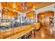Kitchen features wood cabinets, granite countertops, and a breakfast bar at 214 S Woodland St, Winter Garden, FL 34787