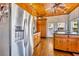Spacious kitchen with wood cabinets, stainless steel appliances, and hardwood floors at 214 S Woodland St, Winter Garden, FL 34787